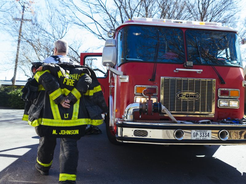 Lieutenant Mark Johnson with the Memphis Fire Department's Fire Station 18 walks beside the station's pumper truck. (Ziggy Mack)