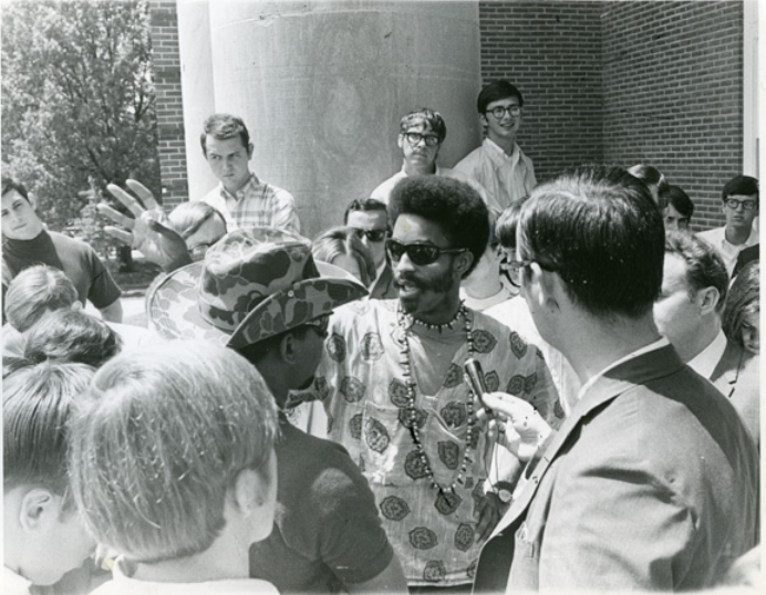 James Mock (center) and other movement leaders meet with members of the press outside the Memphis State administration building in April 1969. (University of Memphis Special Collections)