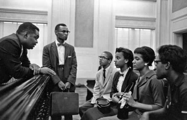 Attorneys H.T. Lockard (left) and A.W. Willis meet with members of the Memphis State Eight, prior to their first day at Memphis State University. (Commercial Appeal Archives) 