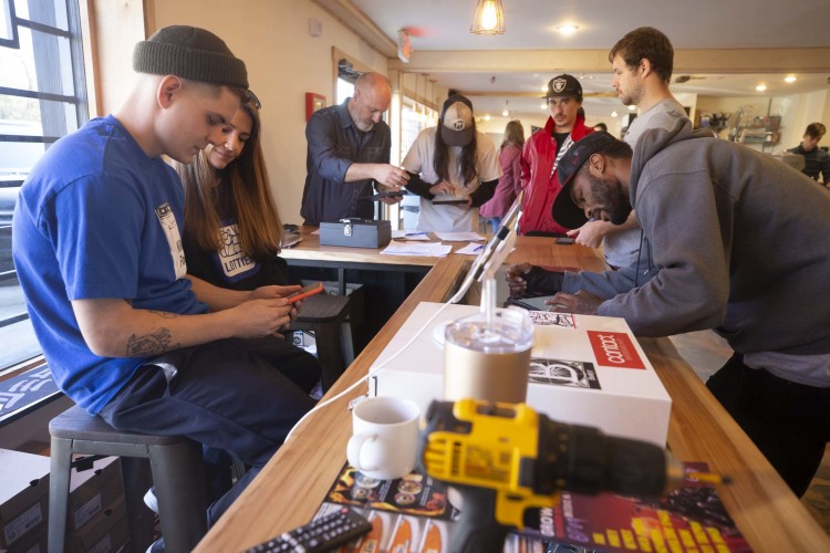 Zac Roberts (far left) owns Contact Skateboard Shop located inside Society Skatepark and Coffee on Scott Street. The complex opened on December 22, 2018. (Ziggy Mack)