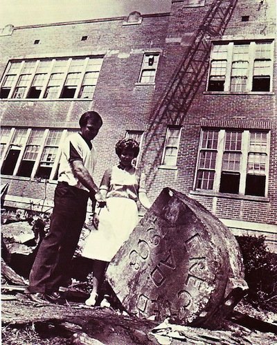The capstone of the original Messick High building sits on the ground following the 1982 demolition. (Special Collections, University of Memphis Libraries) 