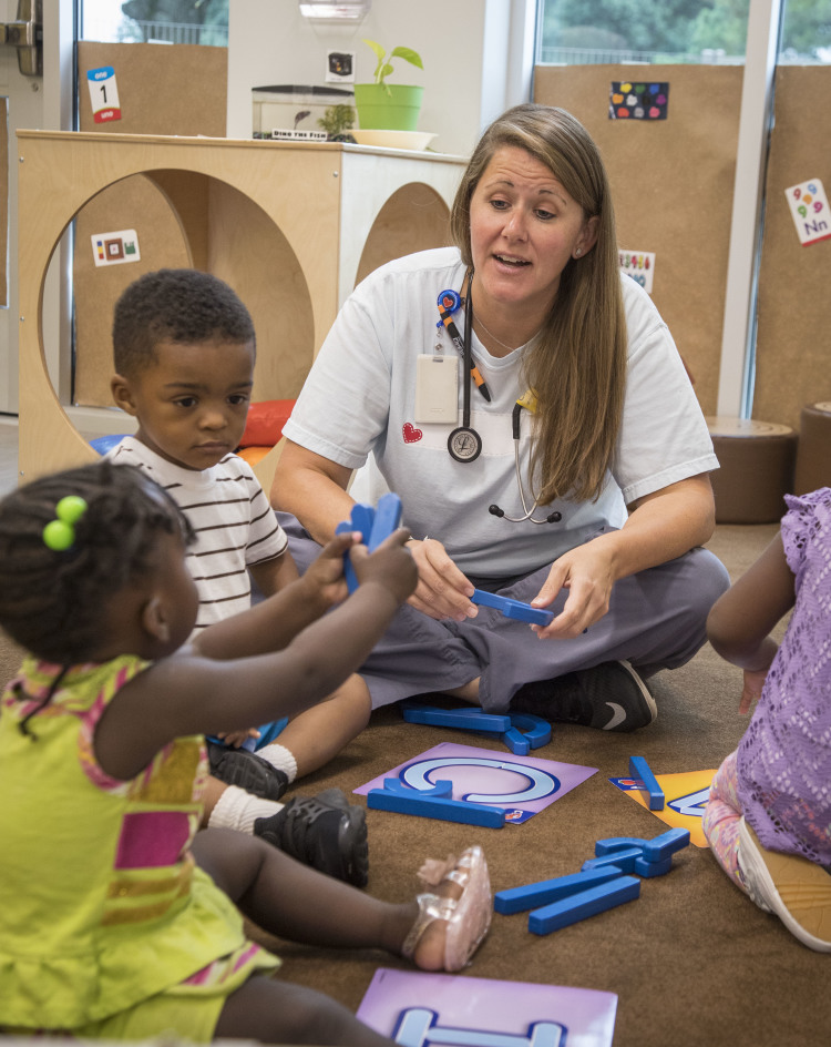 Le Bonheur's Inclusion Support Program Nurse Case Manager Carey Wright observes children during classroom activity. (Submitted, Lisa Buser Photography) 