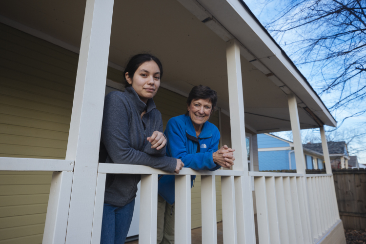 Magaly Cruz and Joni Laney of the Binghampton Land Trust pose in front of a house they helped bring into code compliance. The collective looks to purchase and renovate houses in order to save them from increased prices and gentrification. (Ziggy Mack) 