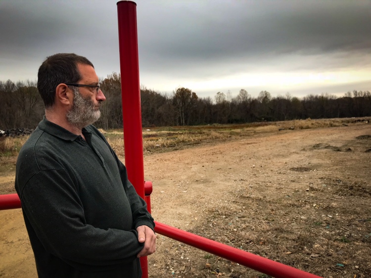 Grady Bennett stands at the entrance to the proposed landfill located at the end of his residential street. (Cole Bradley)