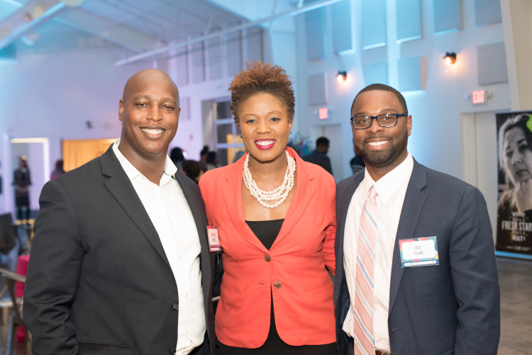 (L to R) Planning committee member Williams D. Brack, United Way's Chief Communications Officer Lori Spicer-Robinson, and director of the Division of Housing and Community Development, Paul Young, post for a photo at Feast of Dreams. (Demarcus Bowser)