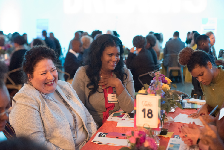 Participants share a laugh, a meal and a conversation on economics and placemaking at the United Way Feast of Dreams. (Demarcus Bowser)
