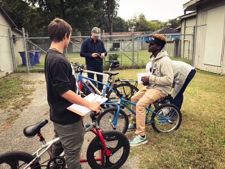 High school interns and members of Like Riding a Bicycle set off to canvas the neighborhood. (Cole Bradley) 
