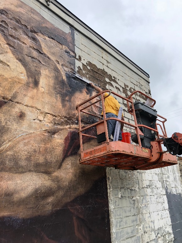 A September installation of a character from " The Slaying of the Medusa" as seen from Summer Avenue.