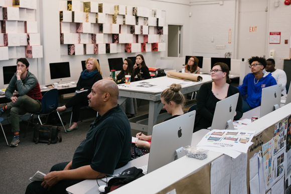 Students listen to Katie Steed's lecture on visual brand identity during a community education class at Memphis College of Art, held in the spring of 2017. (Brandon Dahlberg)