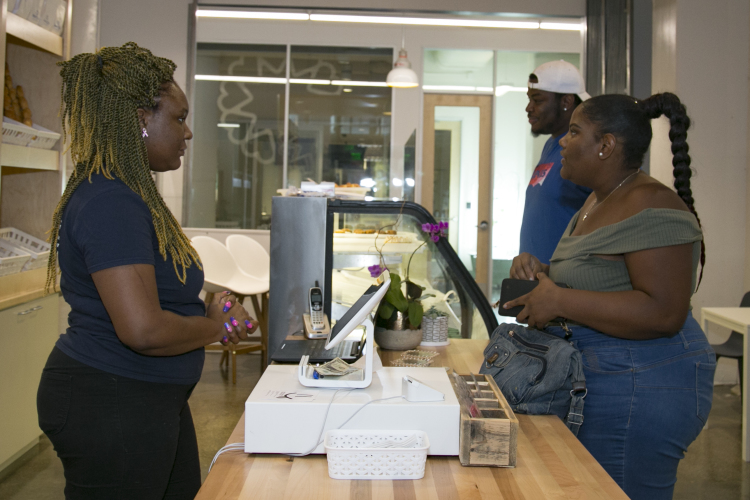 Daria Meeks, 27, takes care of customers at Lucy J's Bakery. (Natalie Eddings)