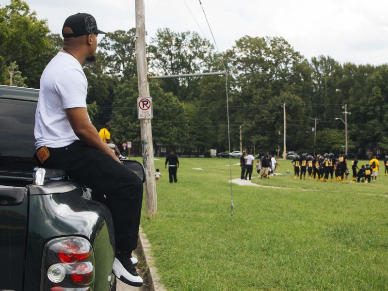 Zan 'Z' Dogan watches his son play in a football game at Treadwell Middle School. Treadwell is the area’s oldest school and opened in 1915. (Ziggy Mack)