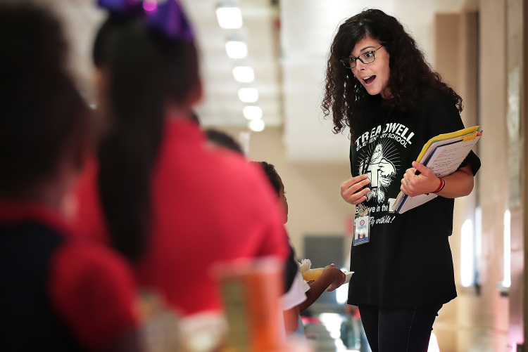 Optional school coordinator Darlene May talks in Spanish with some of Treadwell Elementary School's dual language students as the line up for lunch on September 21, 2018. Treadwell's dual language program immerses kids in both Spanish and English for or full fluency by fifth grade. It's the only program of its kind in Tennessee (Jim Weber/Daily Memphian)
