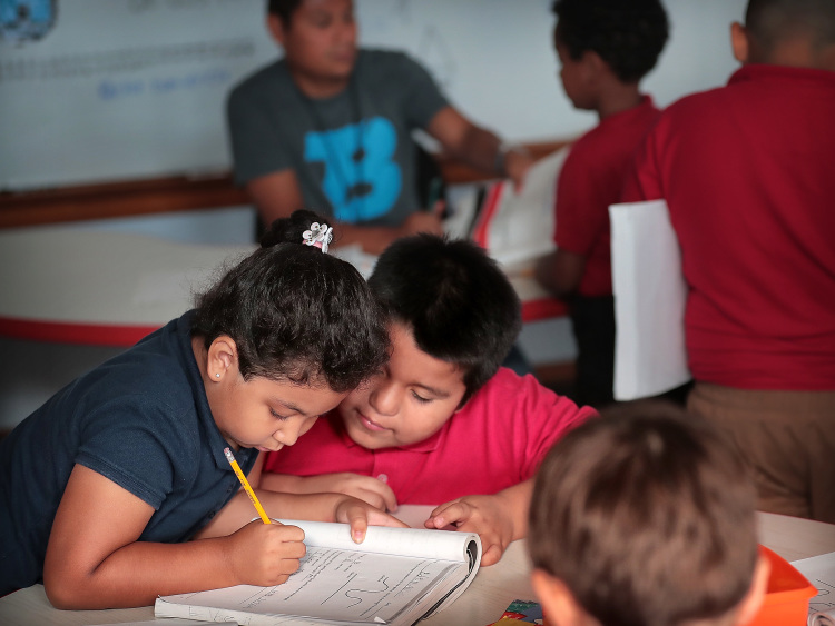 Dasha Palacios (left) helps Bryan Cruz with his math in one of Treadwell Elementary School's dual language classes on September 21, 2018. Treadwell's dual language program immerses kids in both Spanish and English for full fluency by fifth grade. It's the only program of its kind in Tennessee (Jim Weber/Daily Memphian)