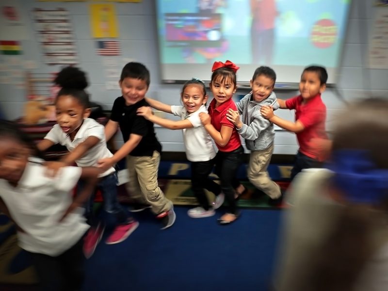 Yvonne Thomas' kindergarteners dance to a song about fruit  in one of Treadwell Elementary School's dual language classes on September 21, 2018. Treadwell's dual language program immerses kids in both Spanish and English for full fluency by fifth gra
