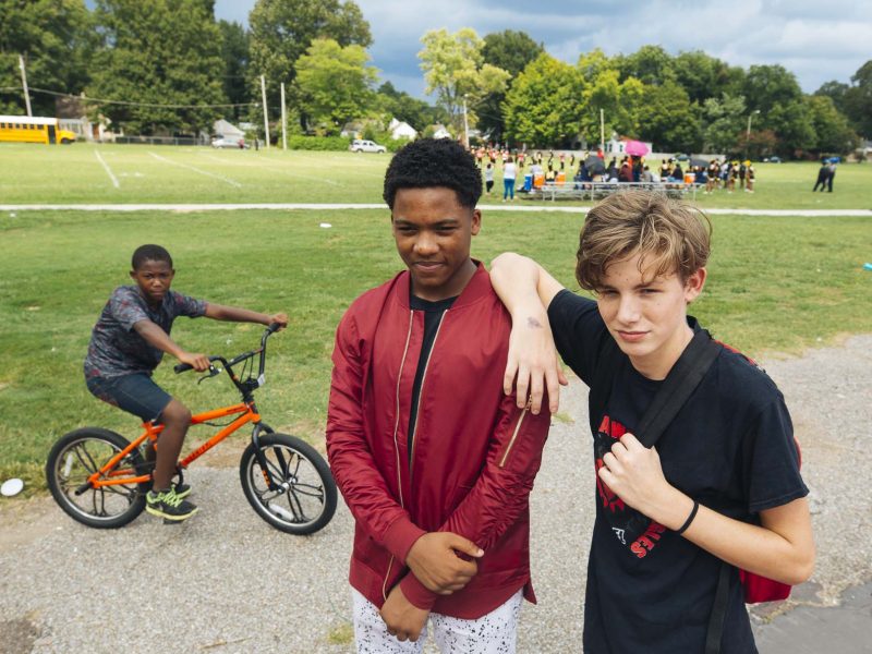 (L to R) Ladarius Shields, Cedric Hicks, and Hayden Williams attend a football game at Treadwell Middle. Treadwell is the area's oldest public school, opened in 1915. (Ziggy Mac)
