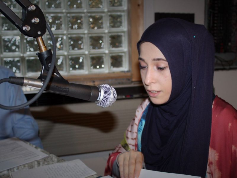 Yasmeen Odeh learns the ropes during a radio workshop led by engineer Jerald White at WMDA 93.5. (Memphis Dawah)
