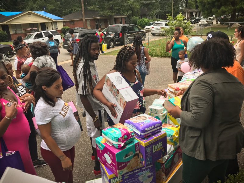 Expectant moms received diapers, wipes, baby clothes, a co-sleeper and more. (Cole Bradley)