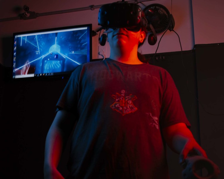 A Bluff City Virtual Reality employee uses reality augmentation equipment at the Cordova location. (Ziggy Mack)