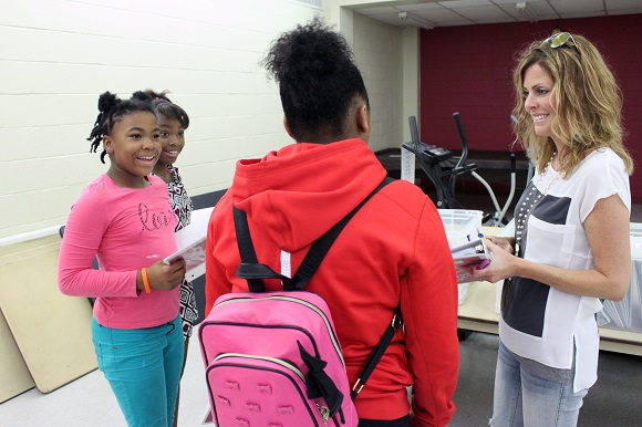 Angel Street founder and executive director Jill Dyson and students prepare for choir rehearsal at the Bickford Community Center.