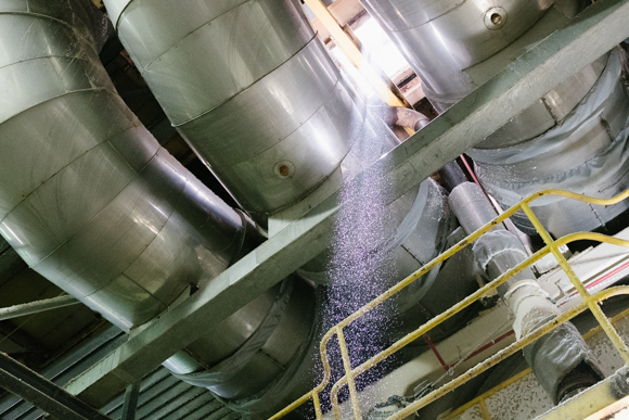 Paper particulates can be seen in a shaft of light in this portion of the facility. (Brandon Dahlberg)