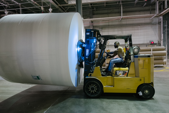 A KTG employee prepares a parent roll for the next stage of manufacturing. (Brandon Dahlberg)
