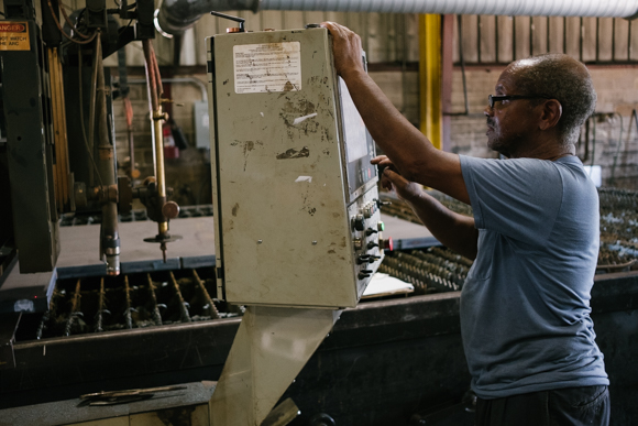 A Southern Steel employee programs a plasma cutter where a two inch thick steel plate is placed. (Brandon Dahlberg)