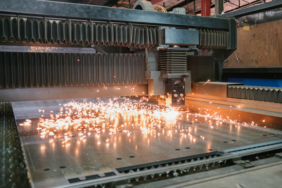 A fiber optic laser makes precision cuts on a steel plate at Southern Steel. (Brandon Dahlberg)