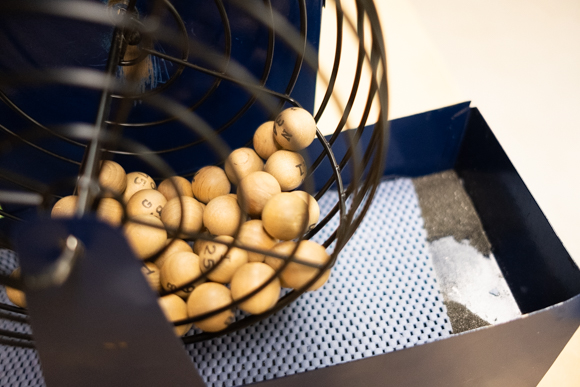 Bingo balls sit inside a hopper while seniors gather to play the game at the Bickford Community Center. (Brandon Dahlberg)