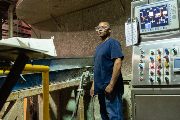 James Durdan, a KTG employee for seven years, moves bales of pulp into the pulper. (Brandon Dahlberg)
