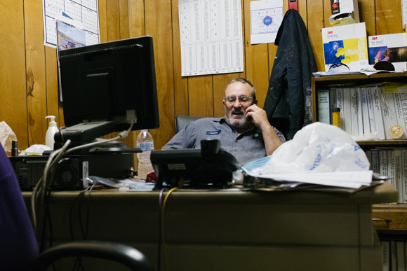 Randy Wetherington, one of the production team leaders, takes a phone call during his lunch break. (Brandon Dahlberg)