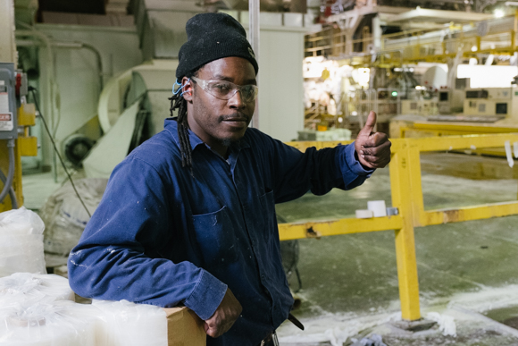 Terrance Davis gives a thumbs up as he prepares a parent roll. Davis is new on the job, and said he is looking forward to his upcoming 30-day evaluation. (Brandon Dahlberg)