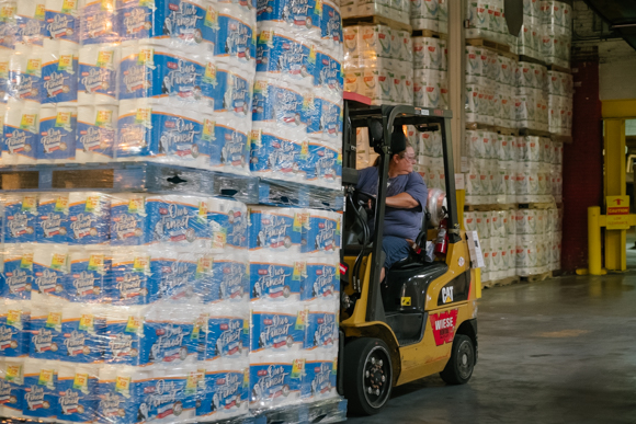 A forklift operator loads product on pallets onto trucks for shipping. (Brandon Dahlberg)