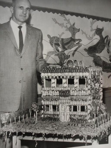 Burt Ferguson of WDIA stands with a model of the Keel Avenue school made by its students. (Mark Stansbury/Memphis World)