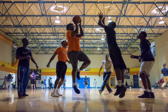 A group of MAM students plays half court basketball inside the gymnasium of the Greenlaw Community Center. (Brandon Dahlberg)