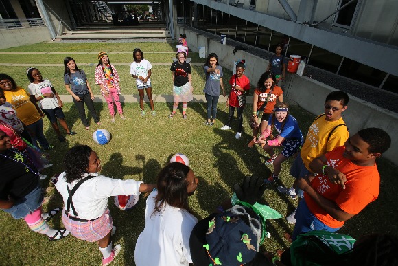 Teens participate in a team building exercise during a BRIDGES youth training event.