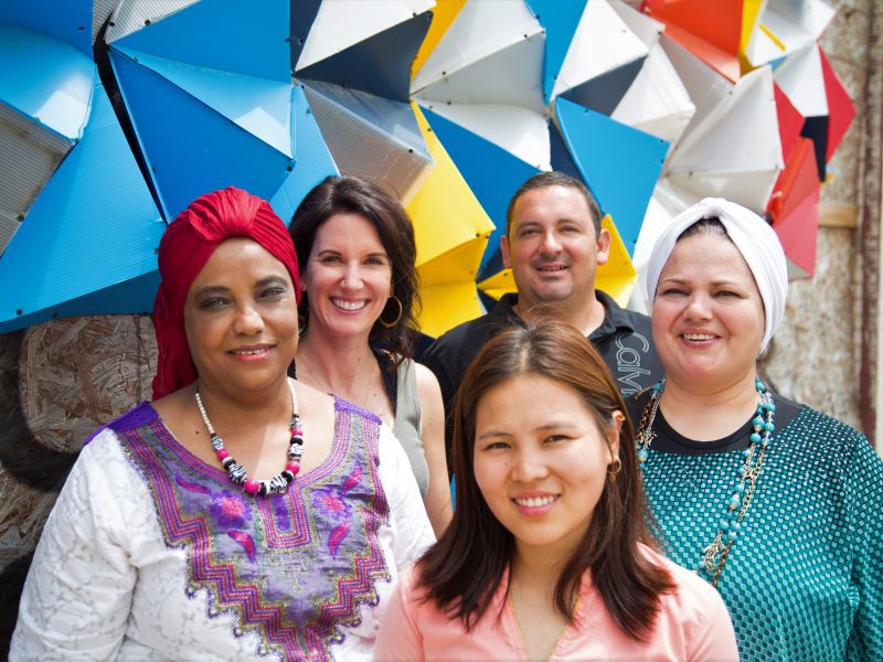 Global Cafe Founder Sabine Langer and General Manager Juan Viramontes with local food entrepreneurs from Sudan, Nepal and Syria. Left to right, Ibti, Sabine Langer, Juan Viramontes, Fayha, and Indra. (Yasmine Omari)