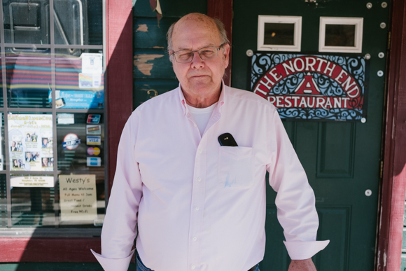 Jake Schorr, the owner of Westy's, poses for a portrait outside the front entrance. (Brandon Dahlberg)