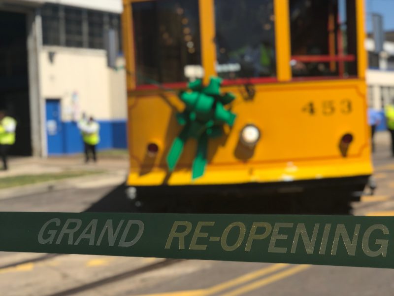 Applause and cheers erupted as the first of the trolleys was guided out of the garage and onto Main St. to await the ribbon cutting. (Shelda Edwards)