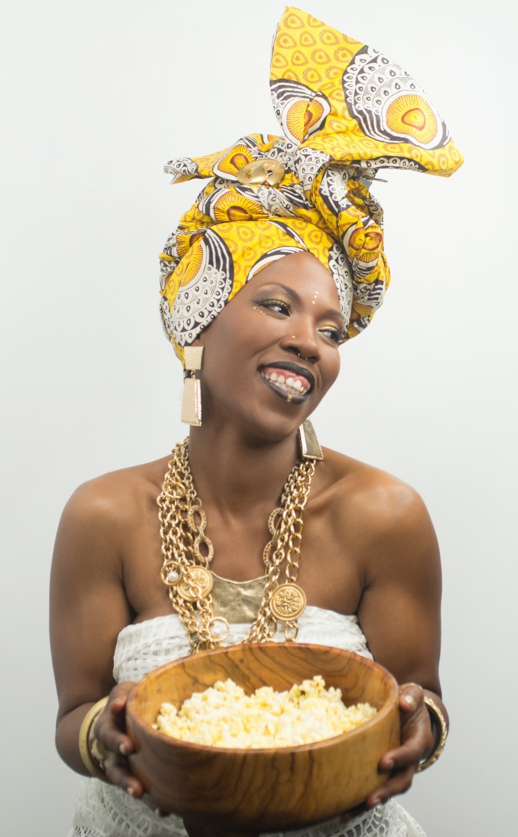 Omi Ogunwale El poses with Green Goddess Gourmet popcorn. (Submitted)