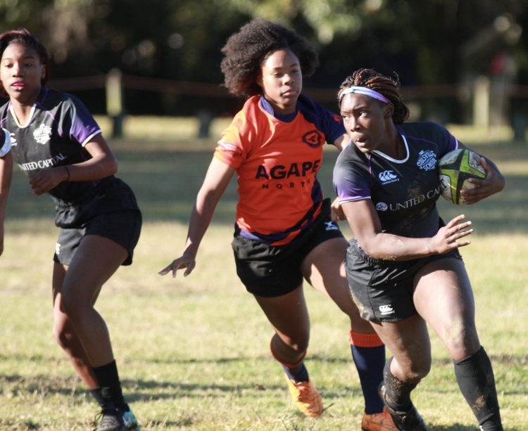 Jayla Hampton (R) of Soulsville Charter School plays for Memphis Inner-City Rugby.