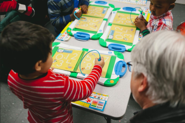 Children of refugee families often face a technology learning curve. Devices like the LeapFrog learner help bridge that gap. (Averell Mondie)