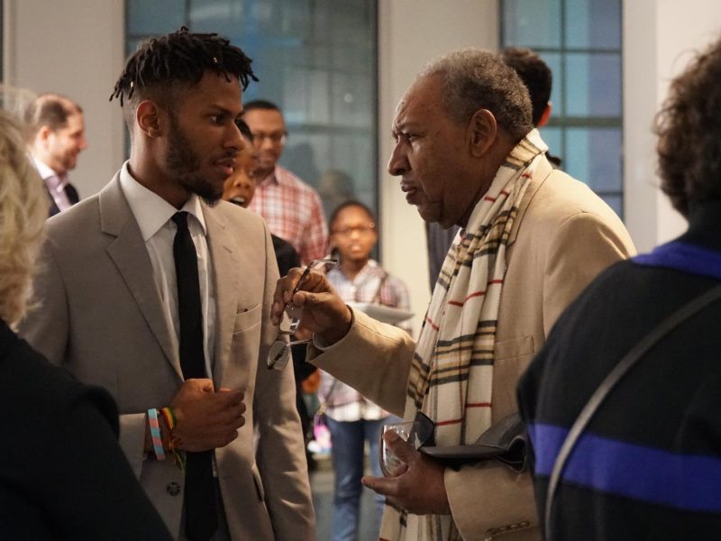 Multimedia artist Lawrence Matthews of The Collective talks with Dr. David Acey, professor of African-American rhetoric and creator of Africa in April at Black Resistance Opening Reception hosted by The Brooks programmed by The CLTV. (Ashley Bend)