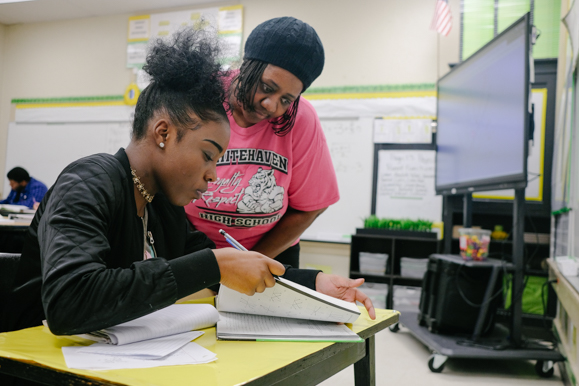 Katriea Joriner, 17, asks Patty Stokes a question. Stokes has been a success coach at Whitehaven High School for three years. (Brandon Dahlberg)