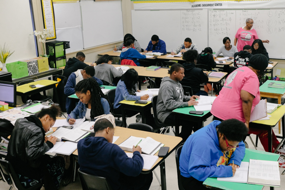 Patty Stokes, a classroom mentor with Peer Poer, and Sondra Bush, a Whitehaven High School teacher, circulate around their classroom. (Brandon Dahlberg)