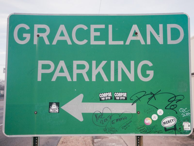 A graffitied sign for Graceland Parking on Elvis Presley Boulevard. (Brandon Dahlberg)
