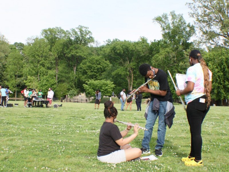On the greensward at Overton Park, members of the Central High School band take a few extra minutes to practice their parts as the rest of the band wraps up practice behind them in 2021. (File photo: Cole Bradley)