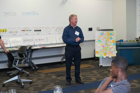 Memphis Fire Department EMS chief Andrew Hart talks to the groups about their ideas to improve the efficiency of the 911 call center. 