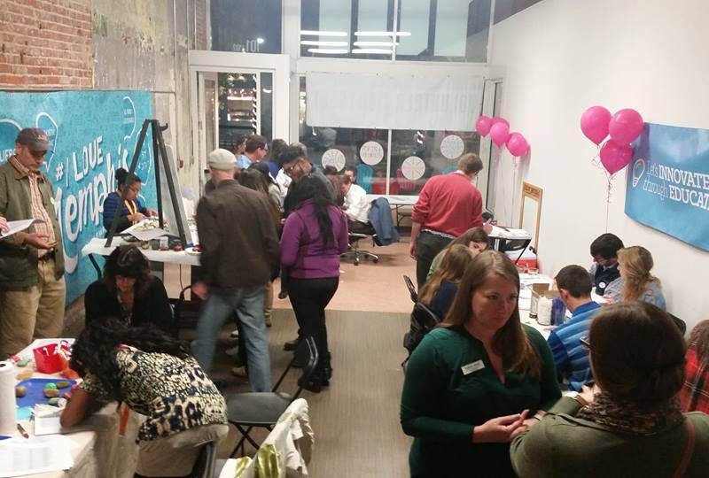 Dr. Sarah Petschonek (foreground) works with volunteers at a Downtown volunteer pop-up event.