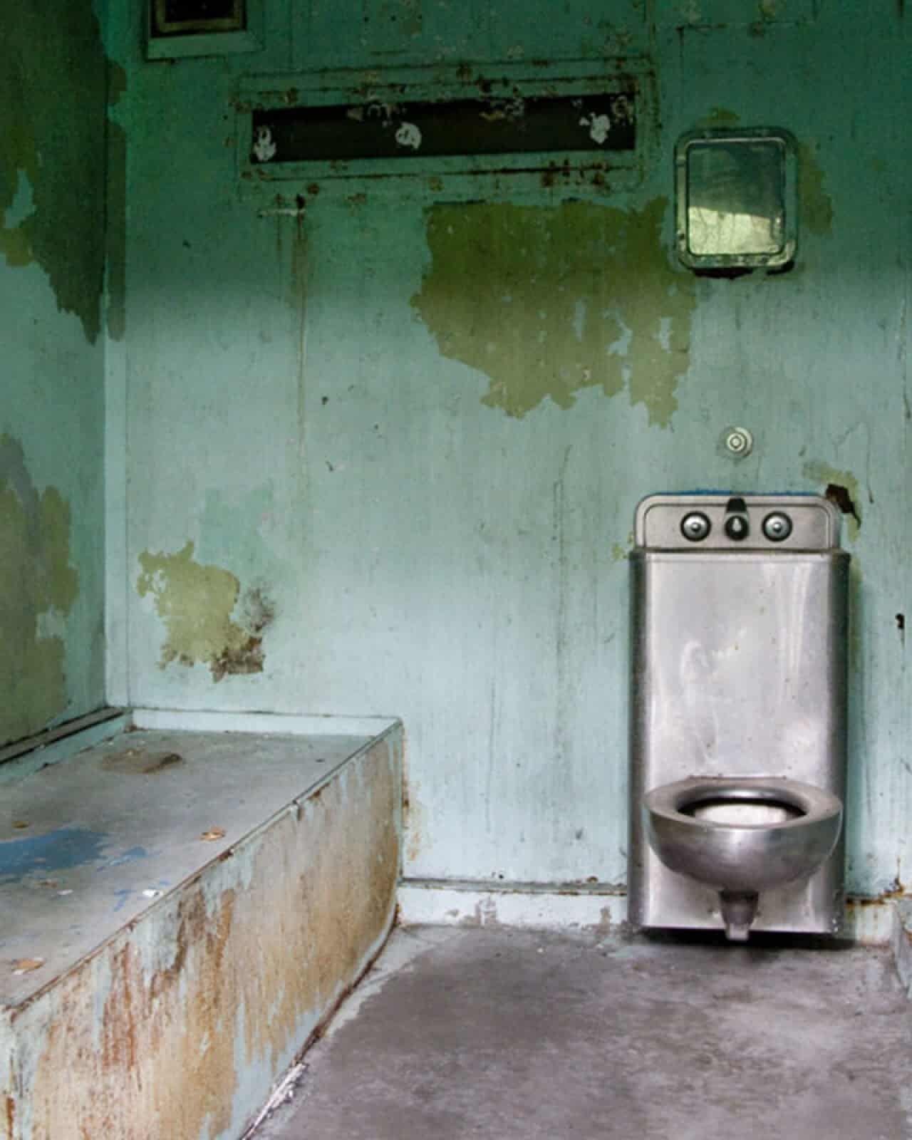 A portion of the former maximum-security prison unit at Lorton Reformatory remains intact, with cell blocks preserved.