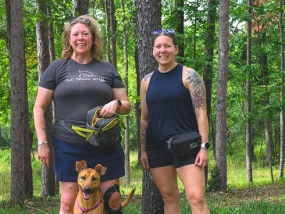 Hannah Ashmore and Sara Samborn with Kenna, a Michigan Conservation Dog trained to sniff out invasive spotted lanternflies.
